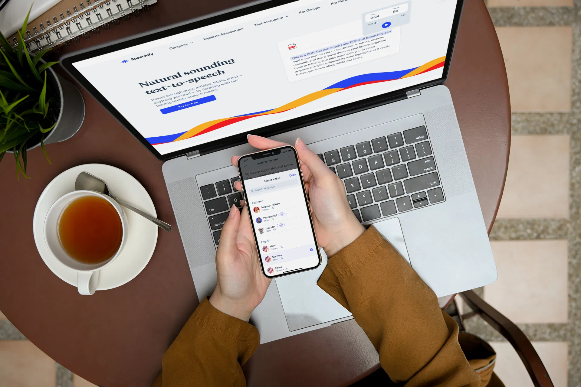 macbook pro mockup featuring a man checking his iphone at a coffee shop